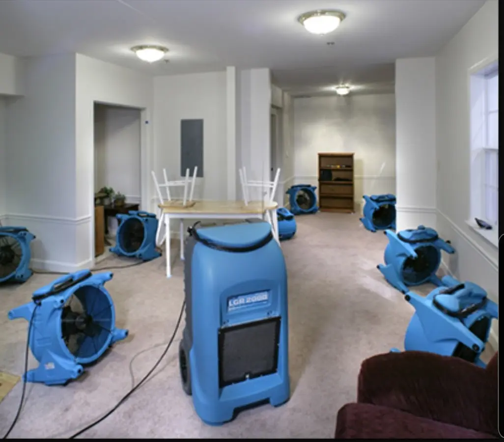 Air movers and dehumidifier setup for Water Damage Restoration in Marion